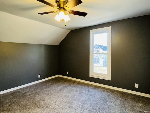 bonus room with vaulted ceiling, carpet, and baseboards