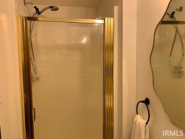 full bathroom featuring a stall shower