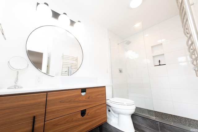 bathroom with vanity, toilet, and walk in shower