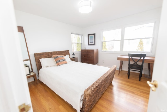 bedroom featuring light wood-style flooring