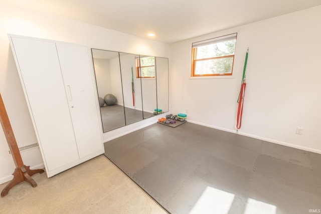 interior space with recessed lighting and baseboards