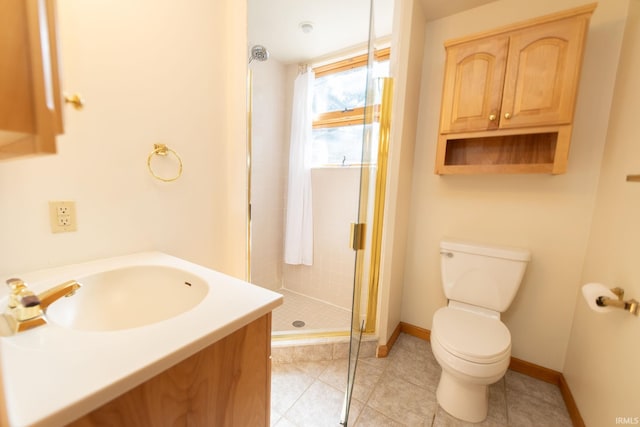 full bathroom with tile patterned flooring, a sink, a shower stall, and toilet