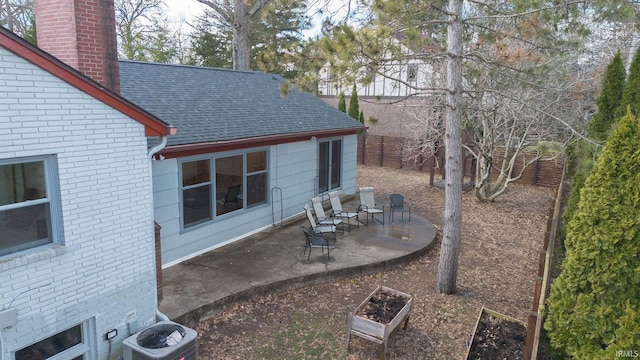 view of yard featuring cooling unit, a patio, and fence