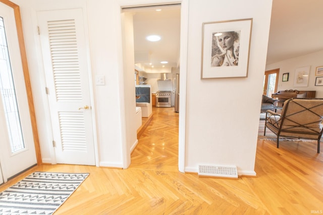 entrance foyer featuring baseboards and recessed lighting