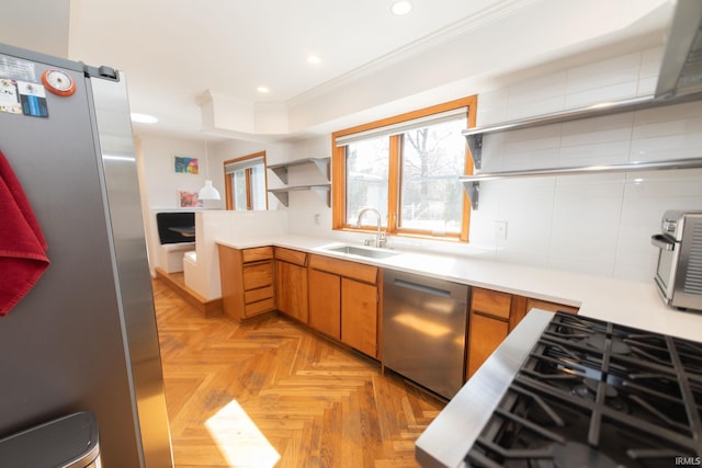 kitchen with a sink, ornamental molding, appliances with stainless steel finishes, backsplash, and open shelves