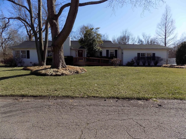 single story home with a front lawn