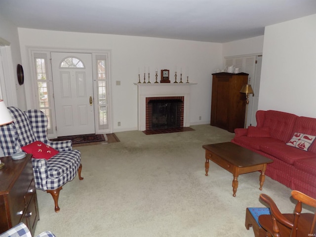 carpeted living area with a brick fireplace