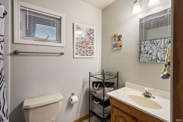 bathroom with vanity, toilet, and a shower with curtain