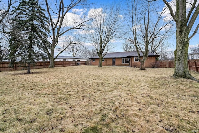 view of yard with a fenced backyard