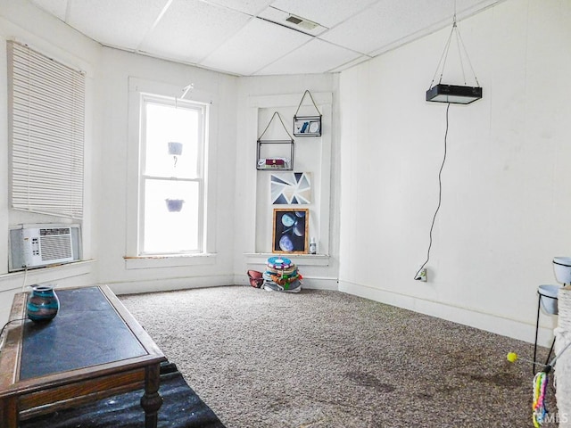 game room featuring carpet floors, visible vents, cooling unit, and a paneled ceiling