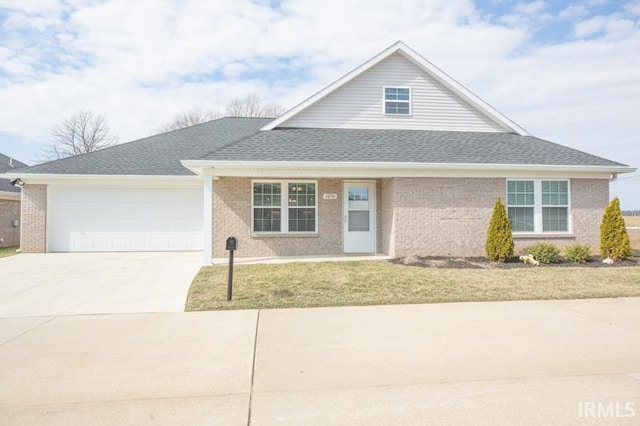 view of front of house featuring driveway, brick siding, a garage, and roof with shingles