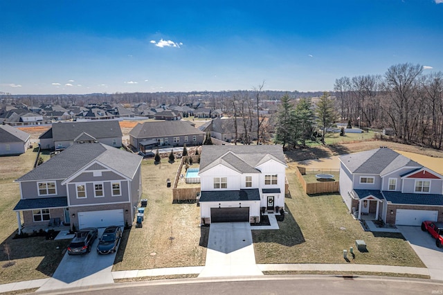 birds eye view of property with a residential view