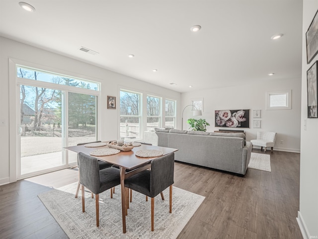 dining area featuring recessed lighting, visible vents, and wood finished floors