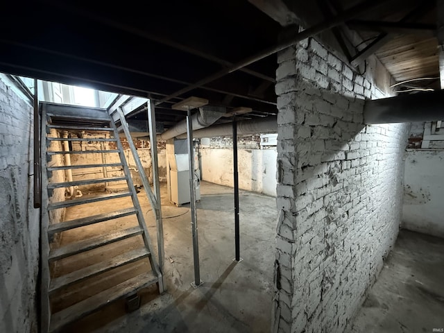 unfinished basement featuring heating unit