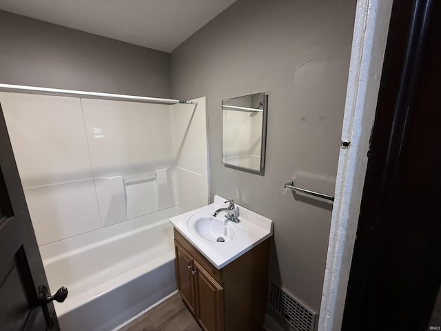 full bathroom with shower / bathing tub combination, vanity, and visible vents