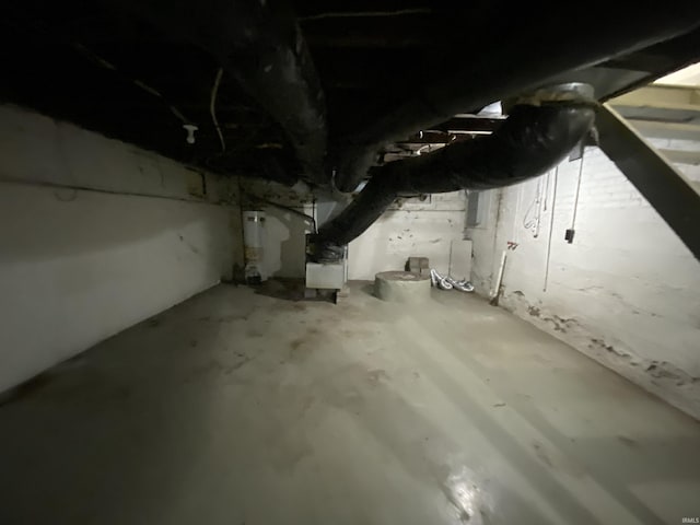 unfinished below grade area featuring gas water heater