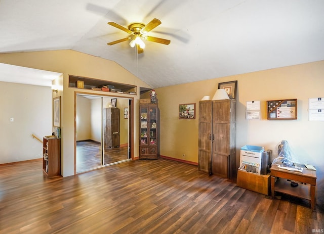 interior space with lofted ceiling, a closet, wood finished floors, and a ceiling fan