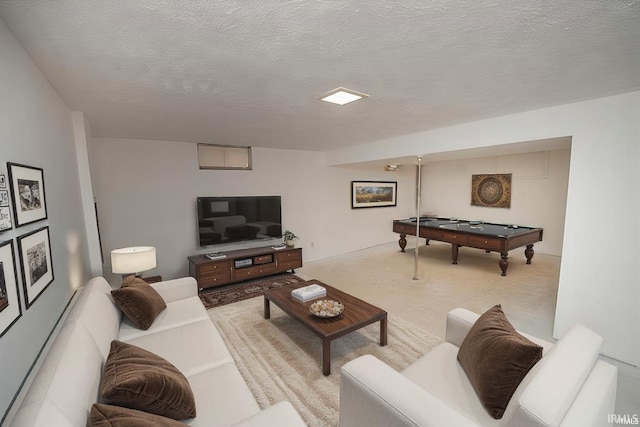 living area featuring billiards and a textured ceiling