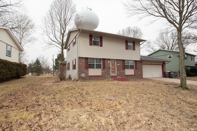 view of front of house featuring a garage, concrete driveway, and brick siding