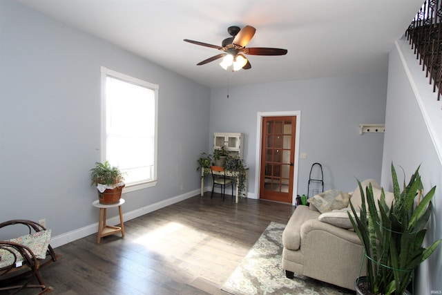 sitting room featuring ceiling fan, wood finished floors, and baseboards