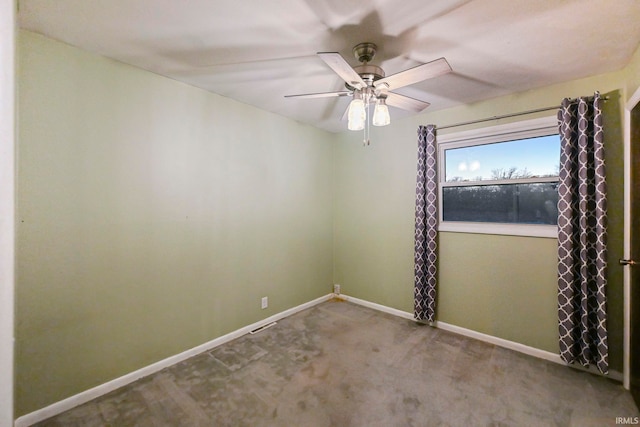 unfurnished room featuring carpet, a ceiling fan, and baseboards