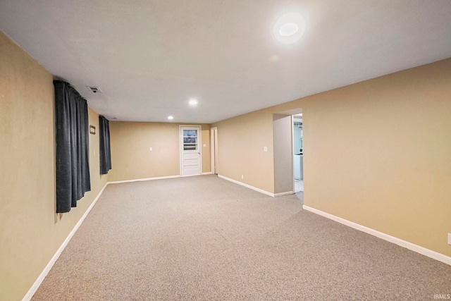 empty room featuring carpet, visible vents, baseboards, and recessed lighting