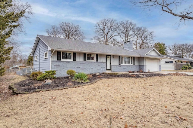 ranch-style home featuring board and batten siding, fence, a chimney, and an attached garage