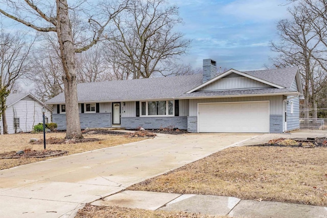 ranch-style house with an attached garage, driveway, roof with shingles, board and batten siding, and a chimney