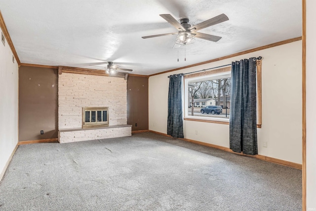 unfurnished living room with carpet, a textured ceiling, a fireplace, and crown molding