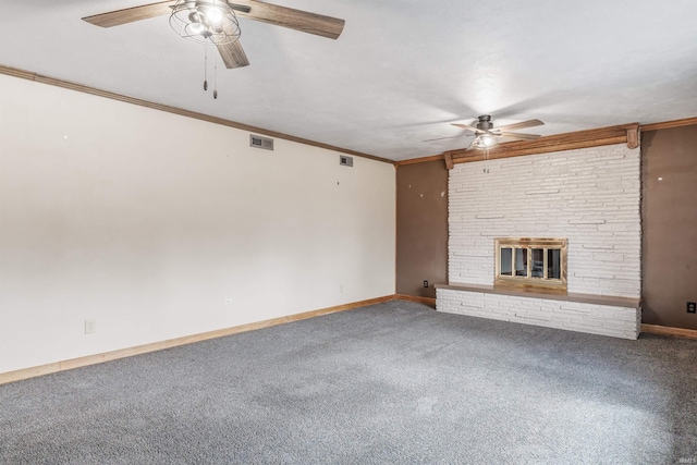 unfurnished living room with visible vents, a ceiling fan, crown molding, carpet flooring, and a fireplace