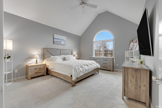 bedroom with lofted ceiling, baseboards, a ceiling fan, and light colored carpet