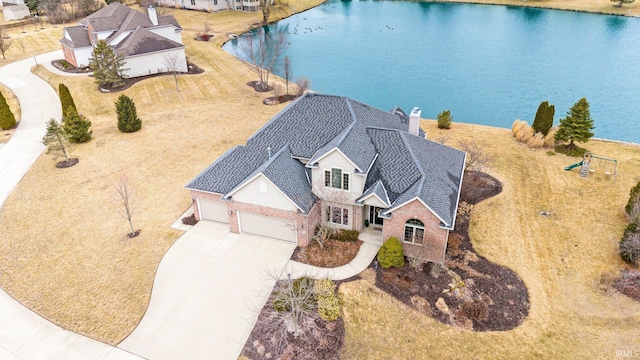 birds eye view of property featuring a water view