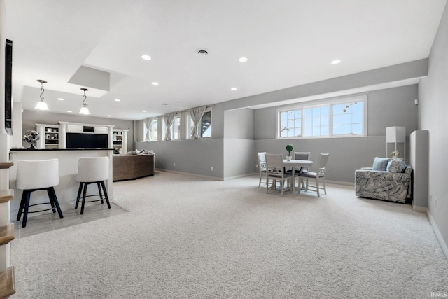 interior space featuring recessed lighting, visible vents, baseboards, and light colored carpet