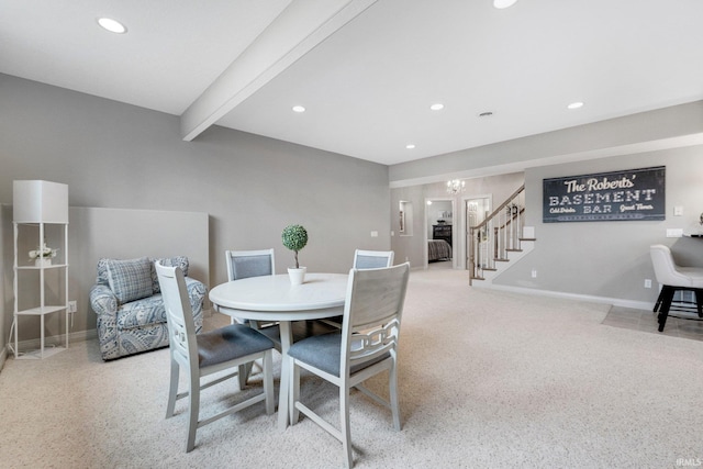 carpeted dining room featuring baseboards, stairway, beamed ceiling, and recessed lighting