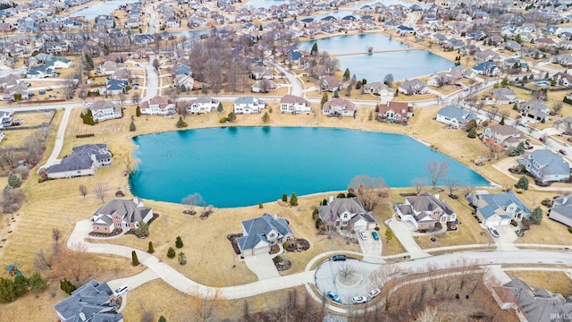 birds eye view of property featuring a residential view and a water view