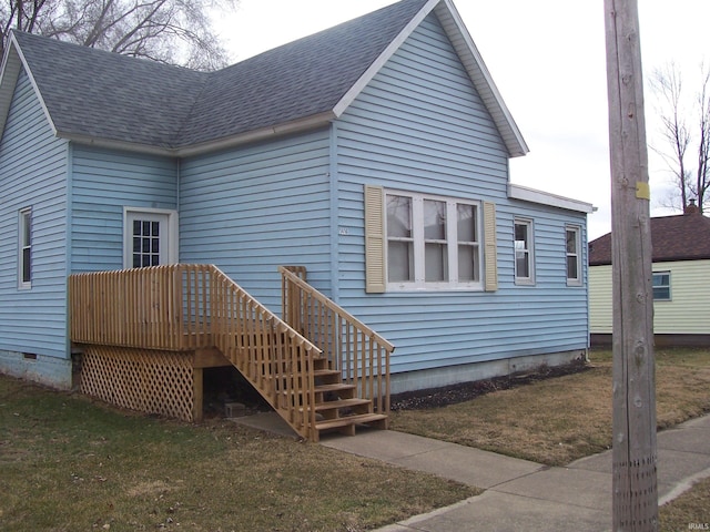 back of house featuring a shingled roof, crawl space, a lawn, and a deck