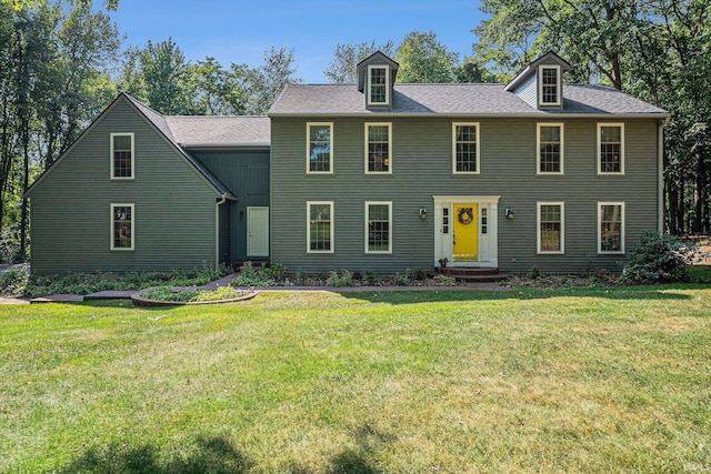 colonial-style house with a front yard