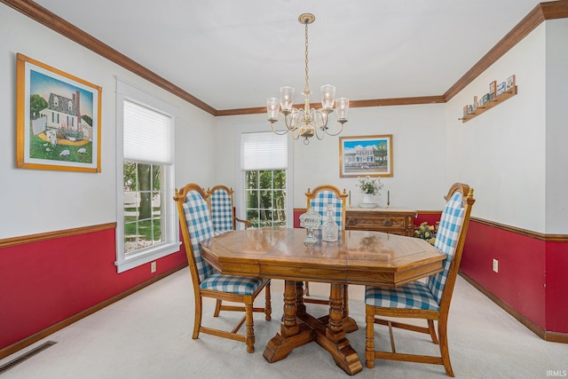 dining area featuring visible vents, a chandelier, crown molding, and light colored carpet