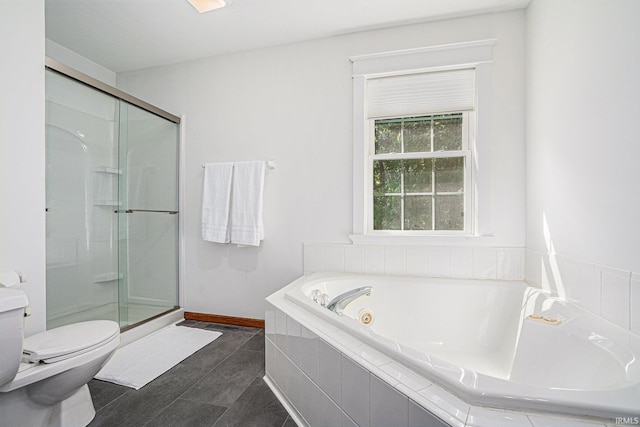 bathroom with a jetted tub, baseboards, a shower stall, and toilet