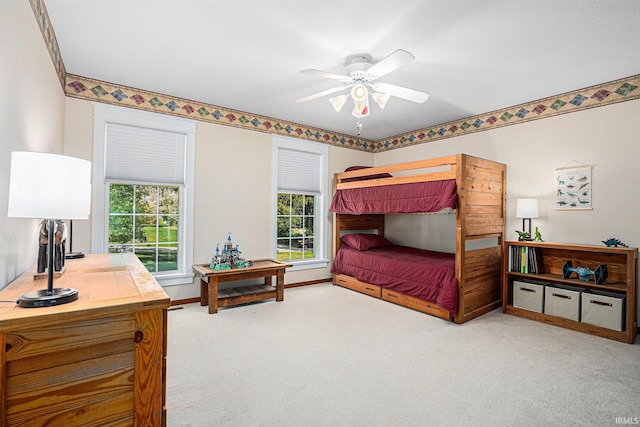 bedroom with carpet flooring, ceiling fan, and baseboards