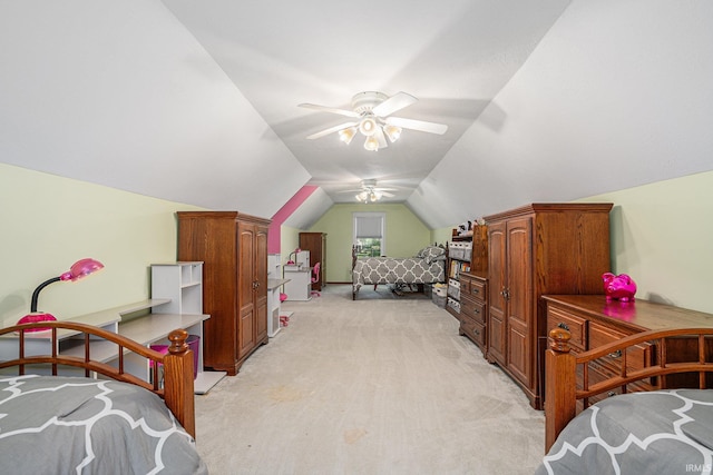 bedroom with a ceiling fan, light carpet, and vaulted ceiling