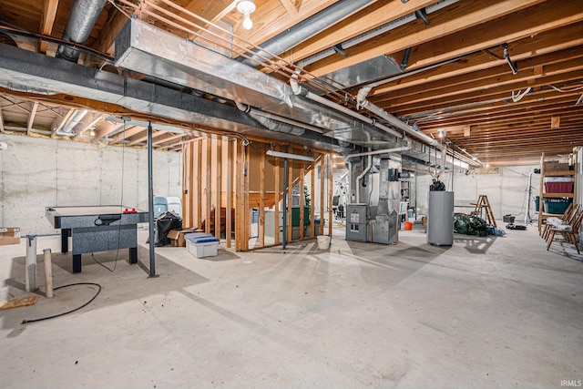 unfinished basement featuring water heater and heating unit