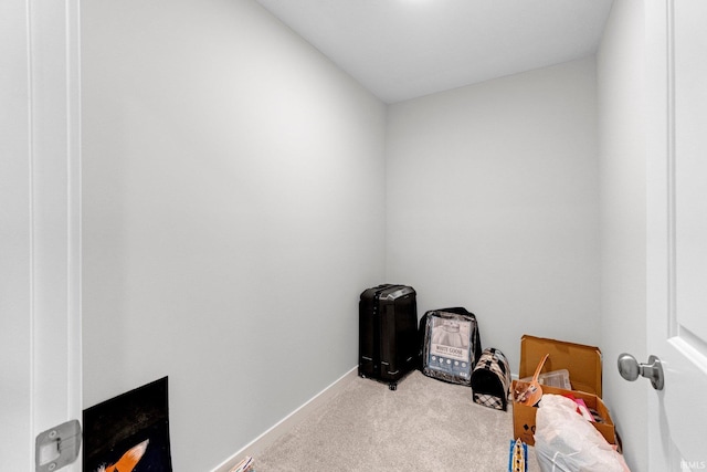 misc room with carpet floors and baseboards