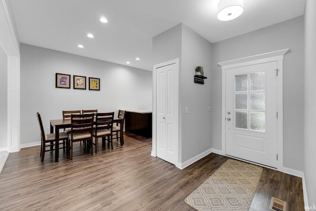 entrance foyer featuring recessed lighting, visible vents, baseboards, and wood finished floors