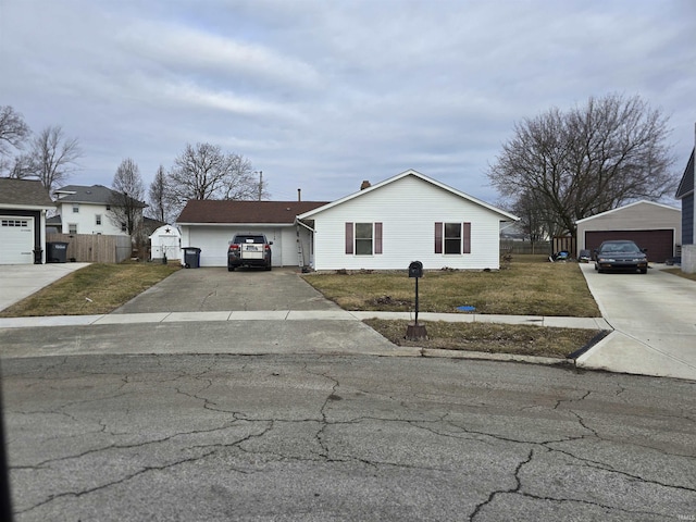 view of front facade featuring a front yard and fence