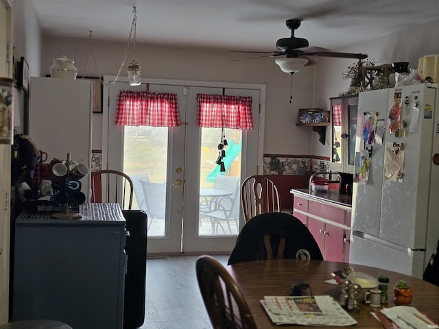 dining space with light wood-type flooring, ceiling fan, and french doors