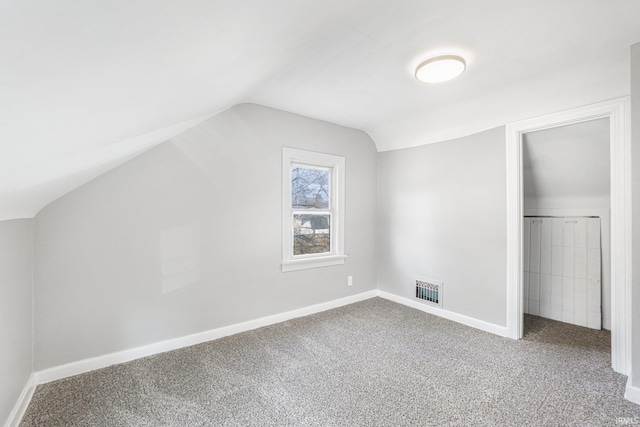 bonus room with lofted ceiling, baseboards, visible vents, and carpet flooring