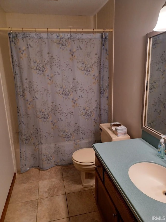 full bathroom featuring shower / bath combo, tile patterned flooring, vanity, and toilet