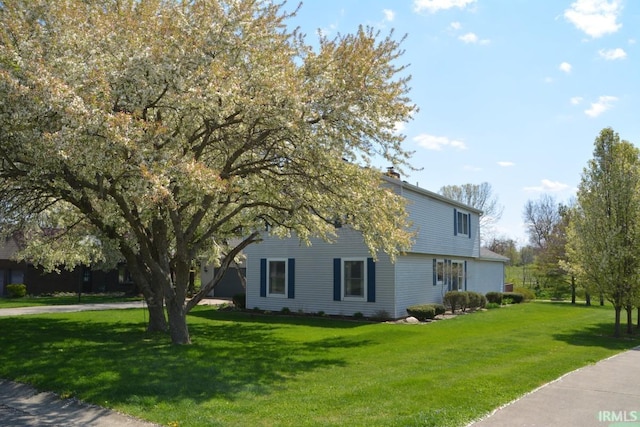 view of home's exterior featuring a lawn