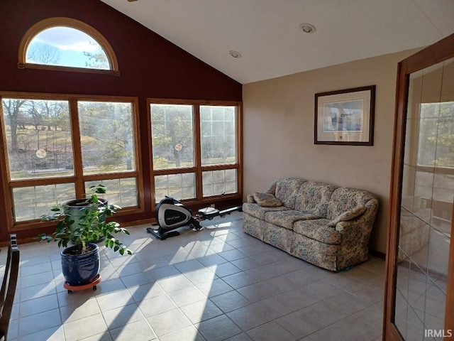 tiled living area with lofted ceiling